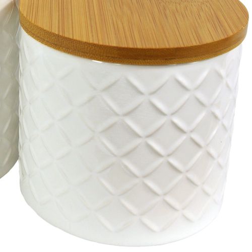 Elegant Duo: Embossed Cream Ceramic Canisters with Bamboo Lids - plants - express.com