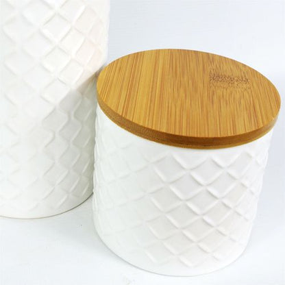 Elegant Duo: Embossed Cream Ceramic Canisters with Bamboo Lids - plants - express.com
